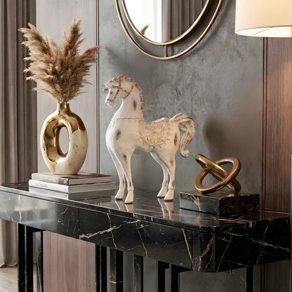 Regalia white resin horse figurine styled on a black marble entryway console