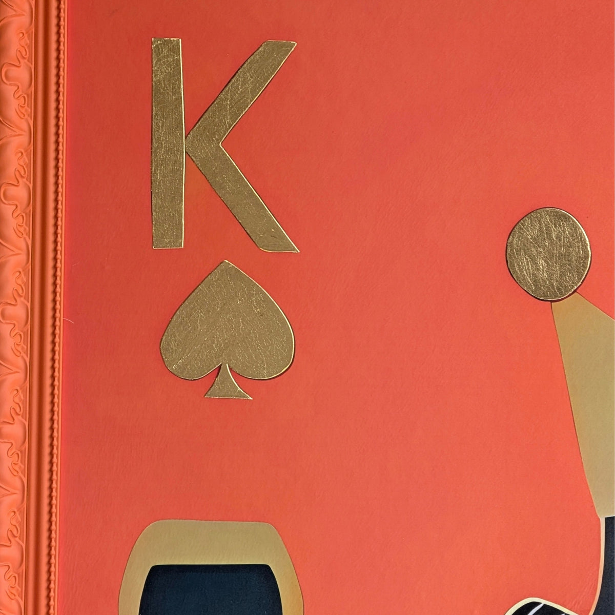 Close-up of the gold foiled playing card symbols on the Royale King wall art