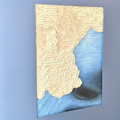Close-up detail of Shore layered leather wall art in blue and gold tones