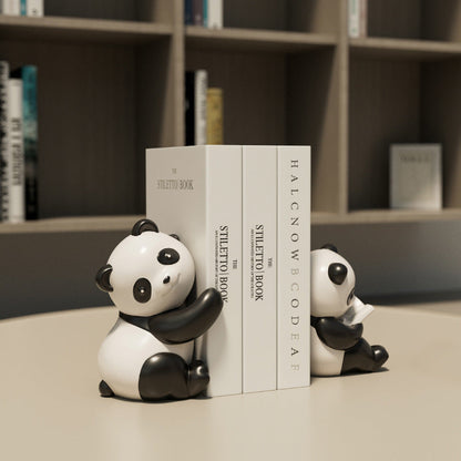 Snugglets panda bookends in a bookshelf setting
