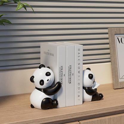 Snugglets panda bookends styled on a console