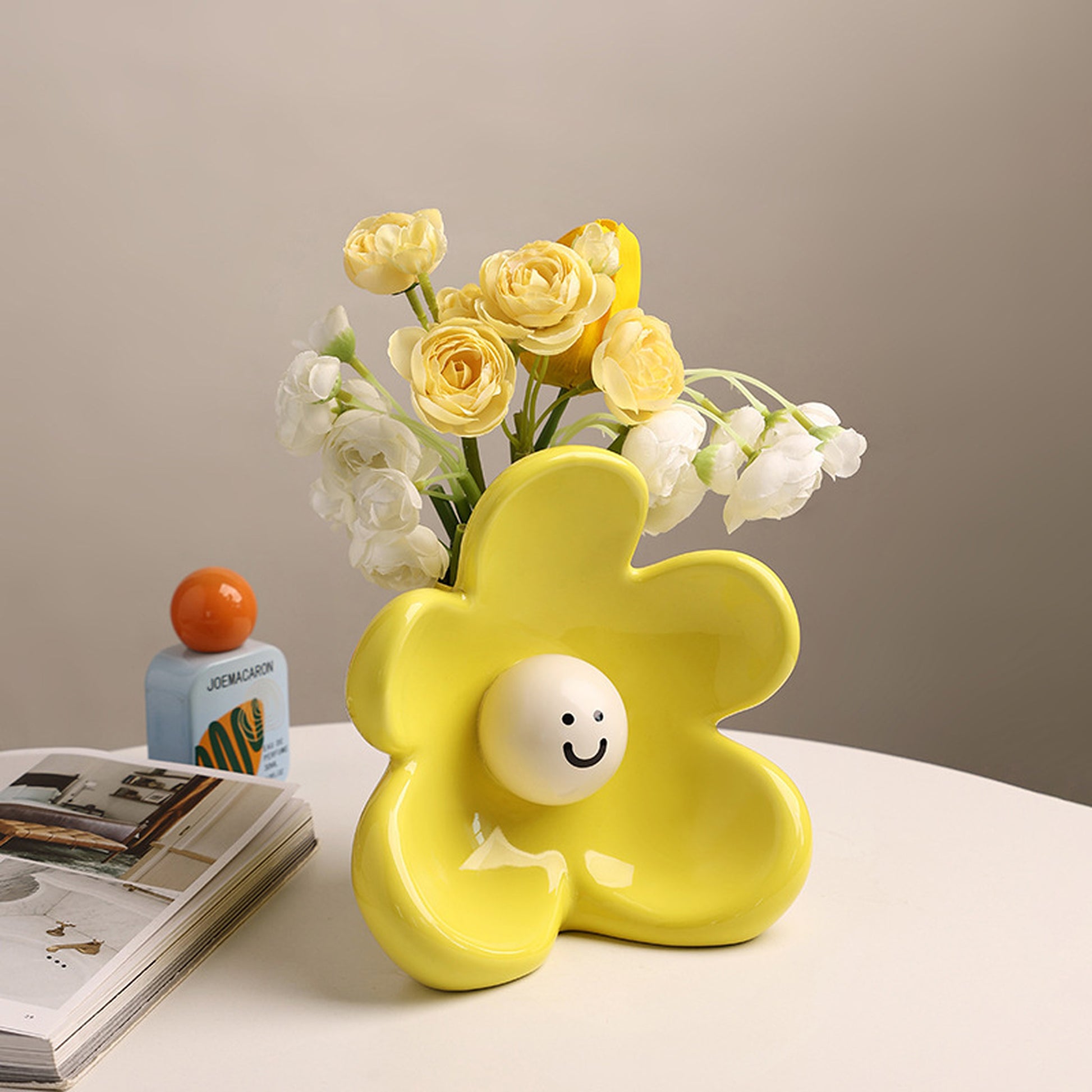 Solara lemon yellow ceramic vase styled on a table