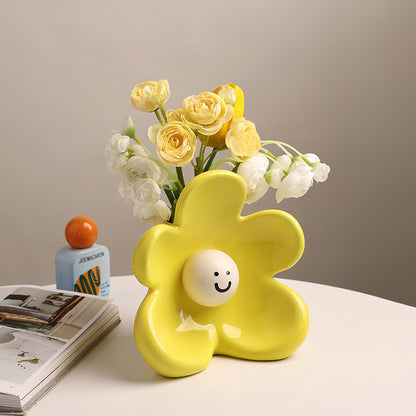 Solara lemon yellow ceramic vase styled on a table