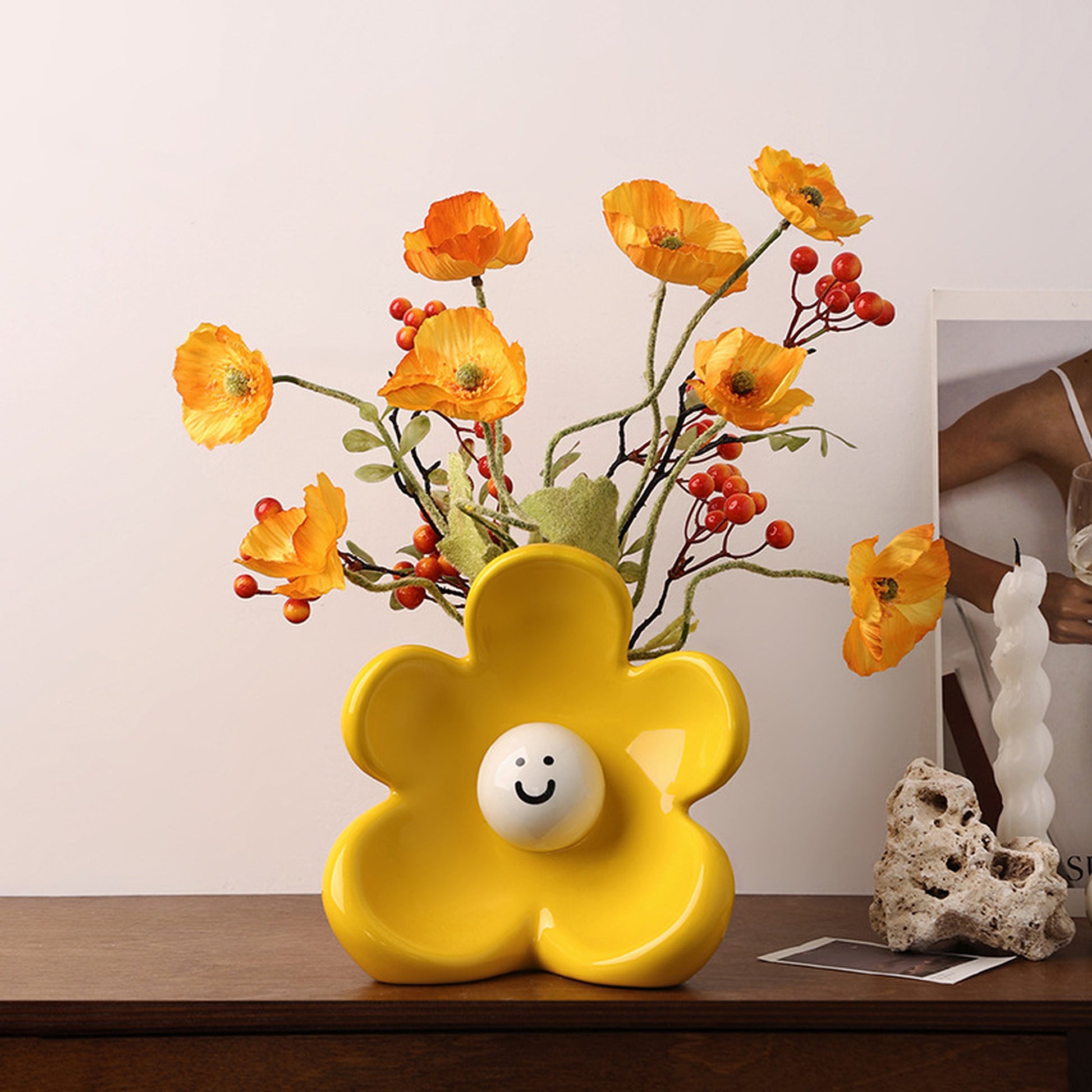 Solara yellow ceramic flower vase styled on a console