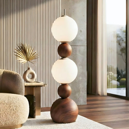 Solstice 4.9 ft floor lamp with glowing frosted glass globes and a wood-grain metal body