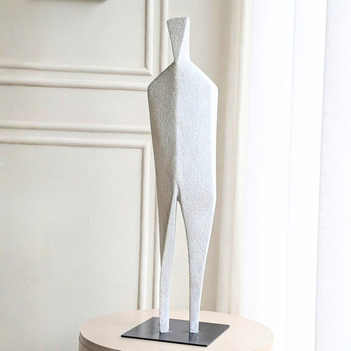 Stature textured white abstract sculpture on a black metal base for console table decor