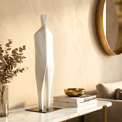 Stature white abstract sculpture styled on a marble sideboard in a warm modern interior