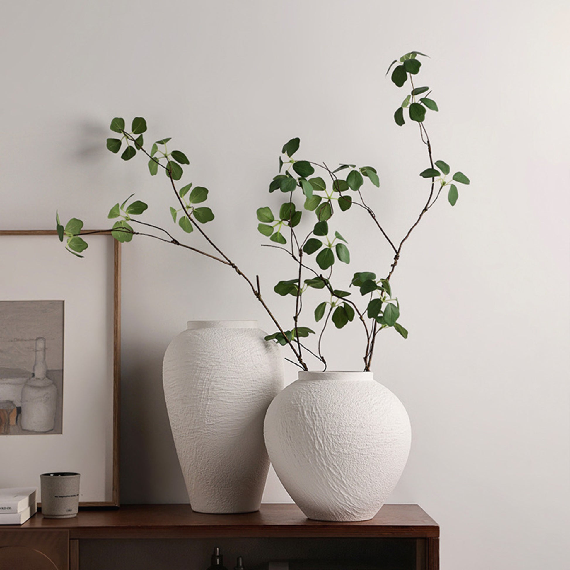 Strata white textured ceramic table vases styled together on a wooden console