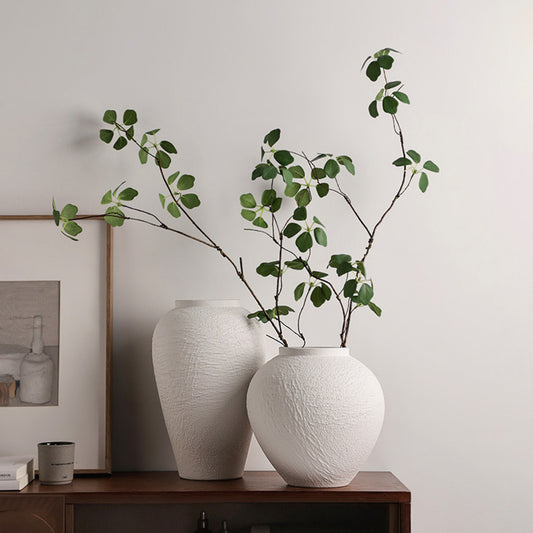 Strata white textured ceramic table vases styled together on a wooden console