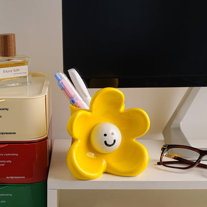 Sunny ceramic flower organizer styled on a study table