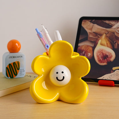 Sunny ceramic flower showpiece styled on a creative desk