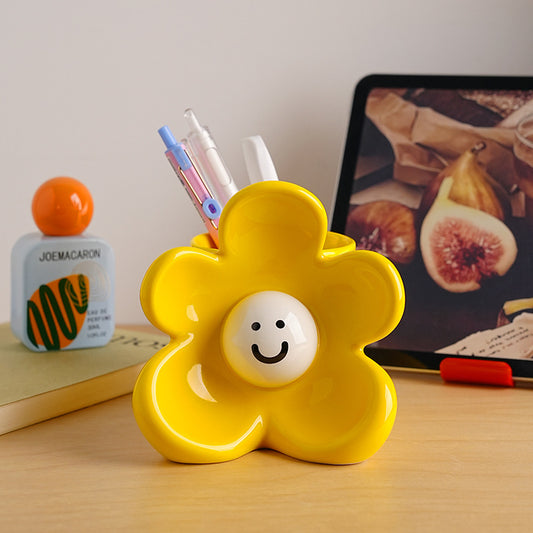 Sunny ceramic flower showpiece styled on a creative desk