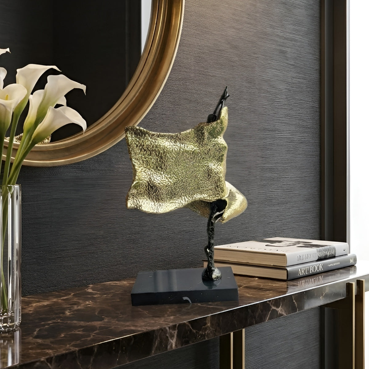 Sway gold-toned lady figurine styled in a modern entryway