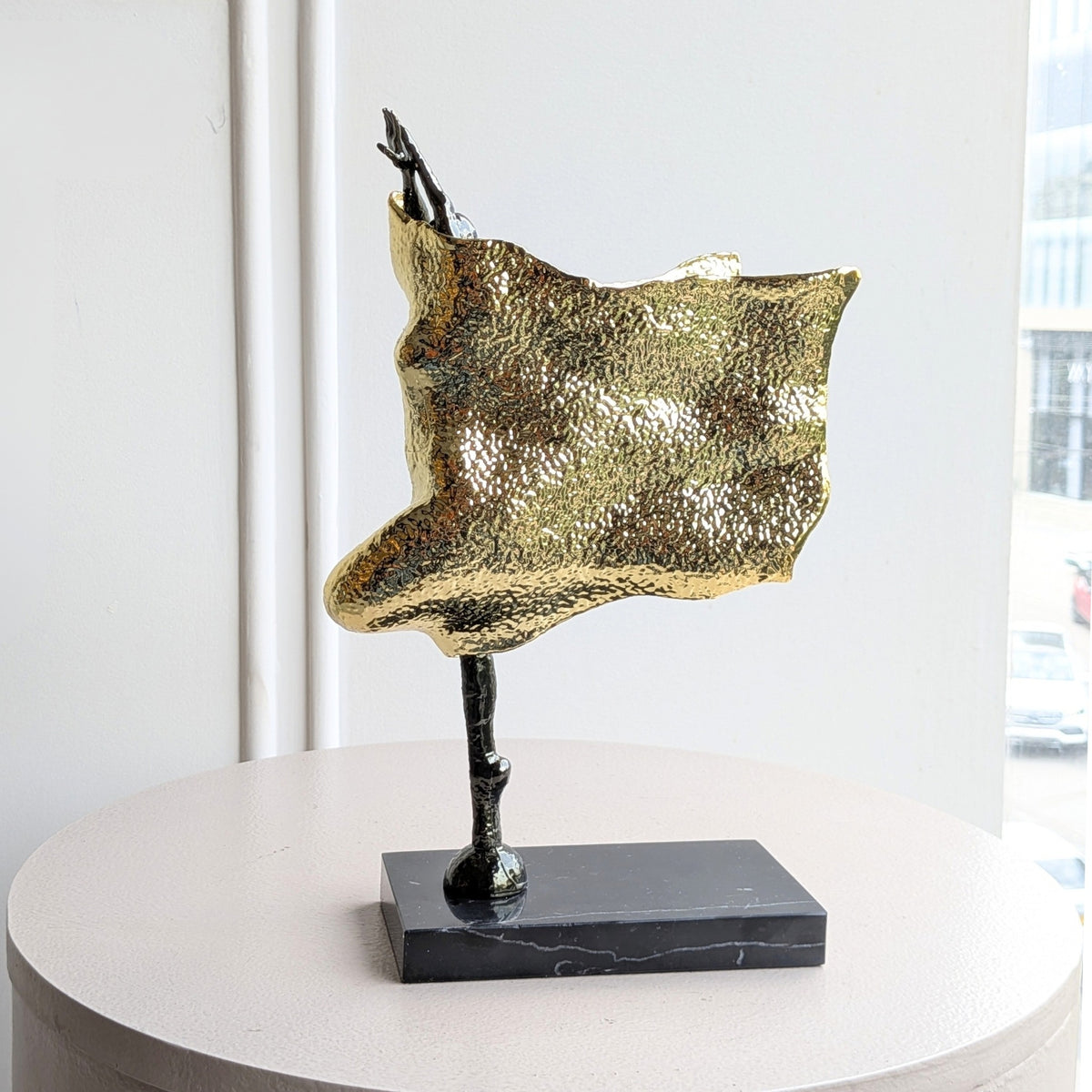 Sway gold-toned metal and marble lady figurine front view