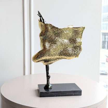 Sway gold-toned metal and marble lady figurine front view