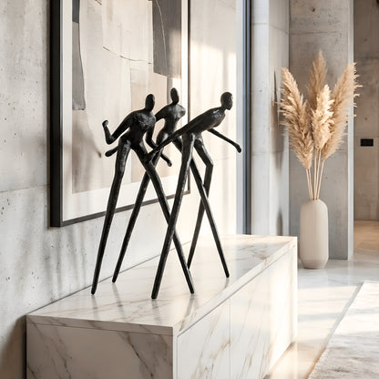 Synergy metal human figurine styled on a marble sideboard in a modern luxury interior
