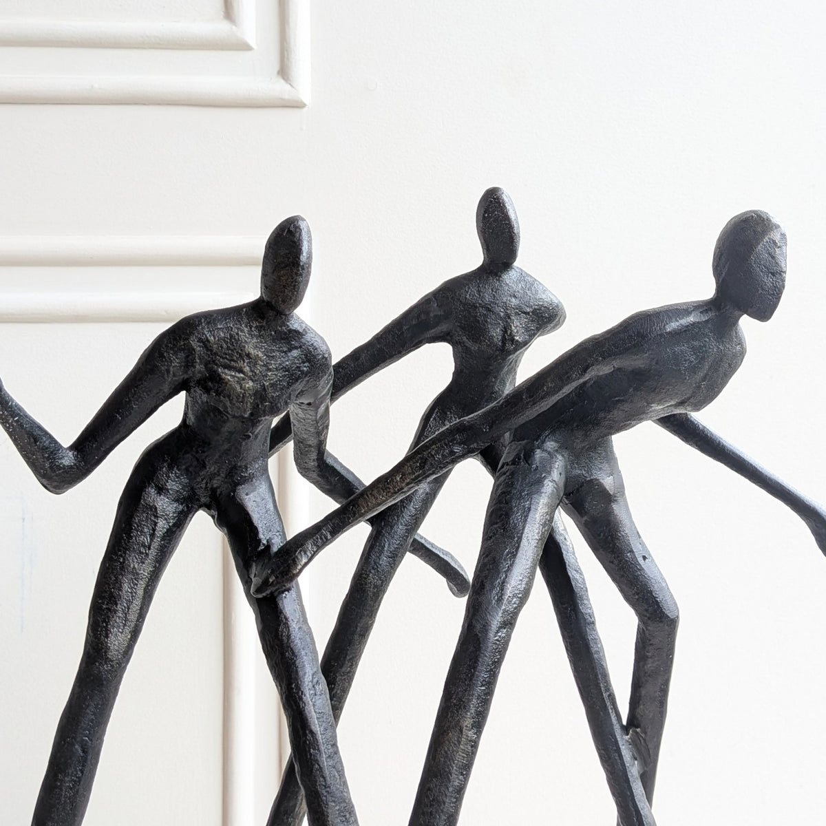 Close-up of Synergy textured metal human figurine with artisanal surface detailing