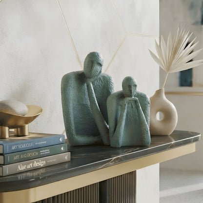 The Contemplatives abstract figurines styled with books on a black console