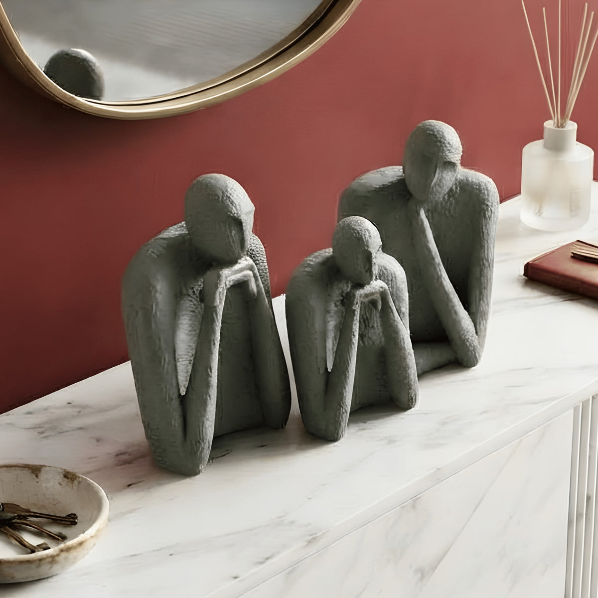 The Contemplatives sage-green showpiece set styled on an entryway sideboard