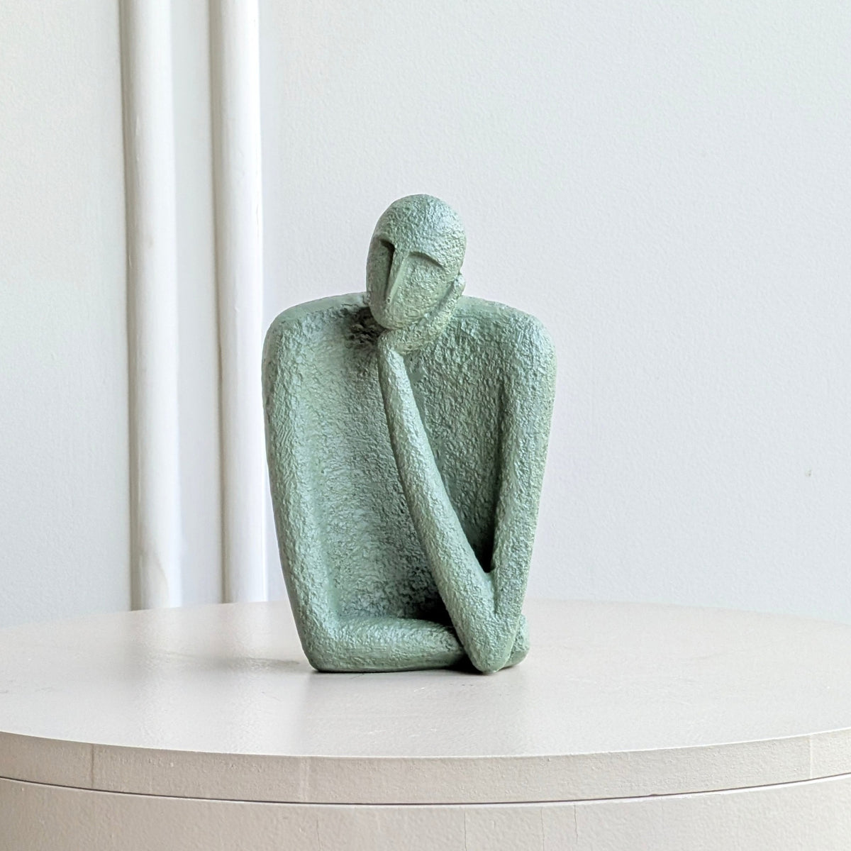 Single sage-green thinking figure from The Contemplatives resin showpiece set
