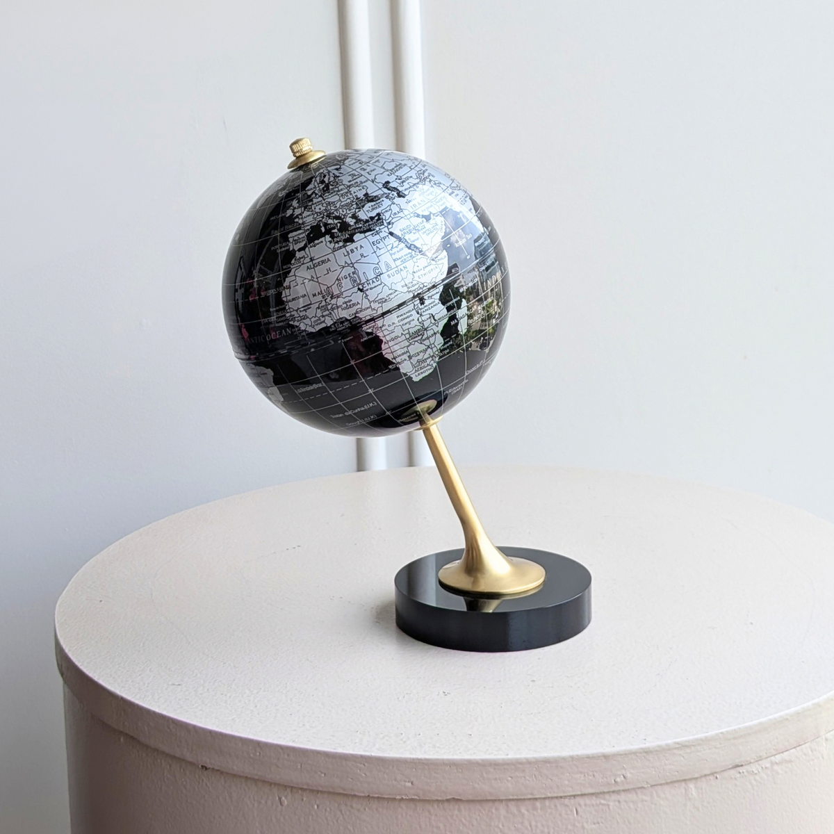 The World metal globe showpiece, alternate angle