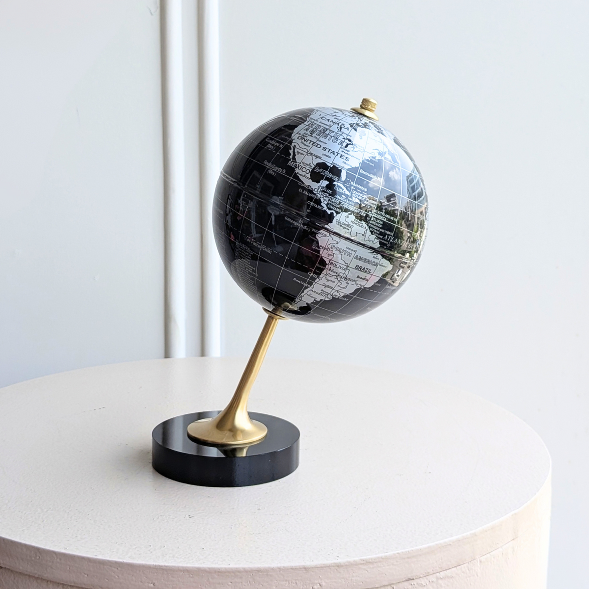 The World black and gold metal globe showpiece, front view