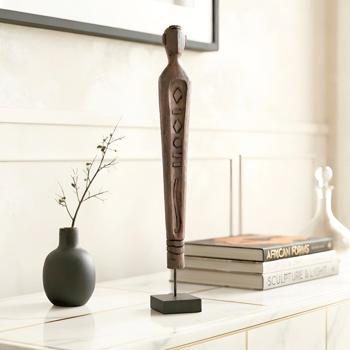 Guardian resin human figurine styled on a console