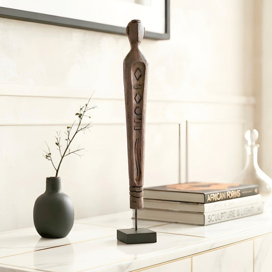Guardian resin human figurine styled on a console