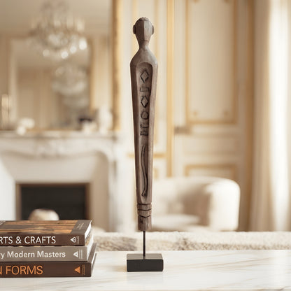 Guardian resin human figurine styled in a warm luxury interior