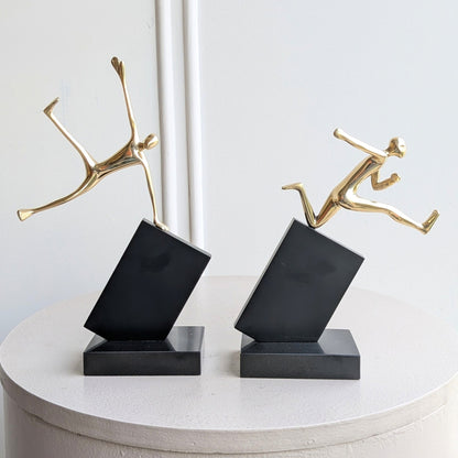 Velocity running and jumping human figurine showpieces front view