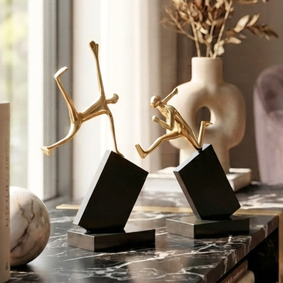 Velocity running and jumping figurines styled on a marble console