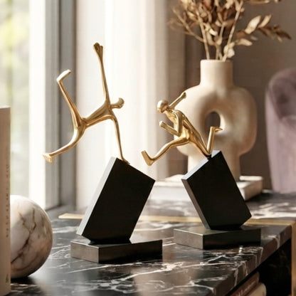 Velocity running and jumping figurines styled on a marble console