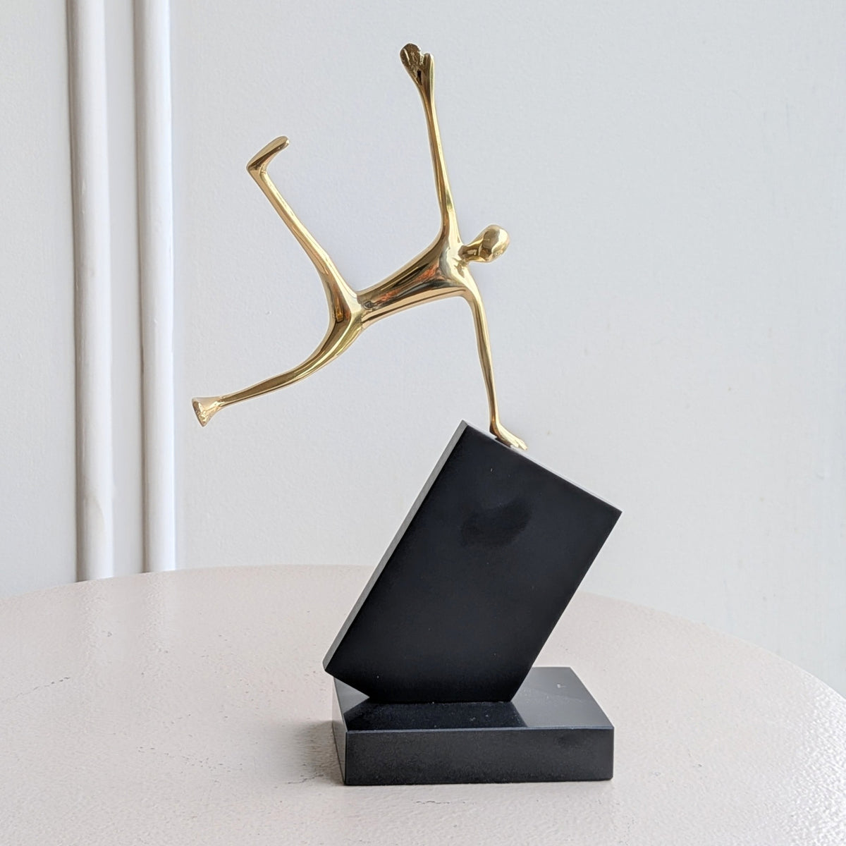 Velocity Jumping gold-tone human figurine front product view