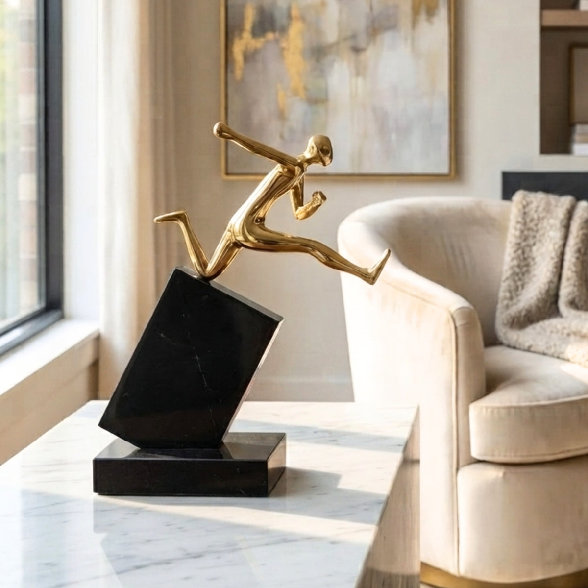 Velocity Running gold-tone metal figurine styled in a living room