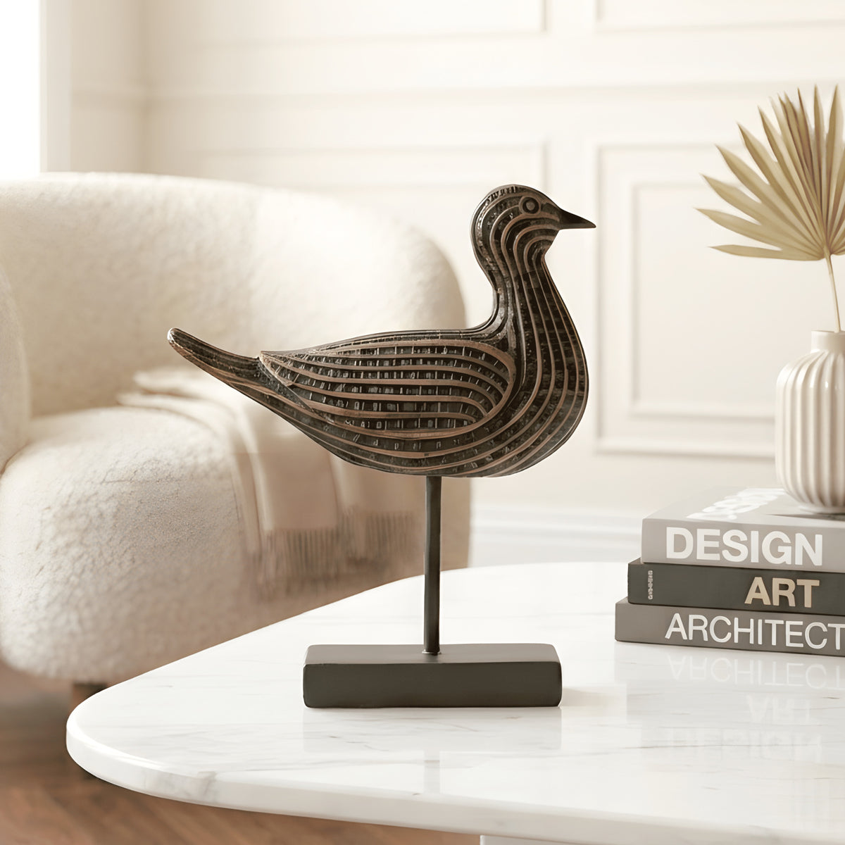 Voyager resin bird showpiece styled on a modern centre table in a living room