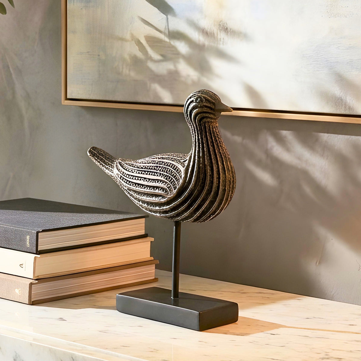 Textured bird showpiece styled on a sideboard for modern living room decor