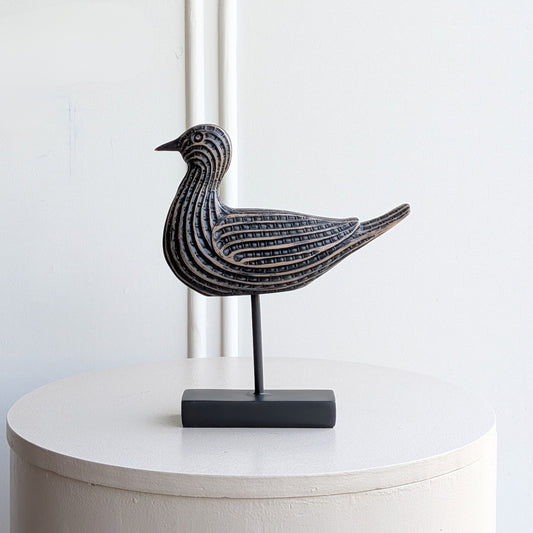 Black and antique-bronze resin bird showpiece on a metal stand for console table decor